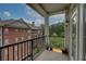 Condo balcony with metal railing and exterior sconce with views of trees and neighboring building at 2300 Peachford Rd # 3411, Dunwoody, GA 30338