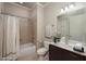 Neutral bathroom featuring shower-tub combo, tile flooring, and a modern vanity at 2300 Peachford Rd # 3411, Dunwoody, GA 30338