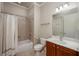 Cozy bathroom featuring a shower-tub combo, vanity with sink, and tile flooring at 2300 Peachford Rd # 3411, Dunwoody, GA 30338