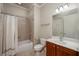 Bathroom featuring shower-tub combo, tile flooring, and a modern vanity at 2300 Peachford Rd # 3411, Dunwoody, GA 30338