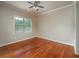 Bedroom featuring hardwood flooring, neutral paint, and natural light at 2300 Peachford Rd # 3411, Dunwoody, GA 30338