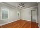 Bright bedroom featuring hardwood floors, crown molding, ceiling fan, and lots of natural light at 2300 Peachford Rd # 3411, Dunwoody, GA 30338