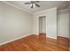 Bedroom featuring hardwood flooring, neutral paint, and crown molding at 2300 Peachford Rd # 3411, Dunwoody, GA 30338