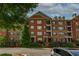 Brick apartment building with multiple levels and private balconies at 2300 Peachford Rd # 3411, Dunwoody, GA 30338