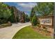 Elegant Sterling of Dunwoody community entrance with manicured landscaping and brick signage at 2300 Peachford Rd # 3411, Dunwoody, GA 30338