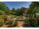 Lush community garden provides residents the opportunity to grow their own produce at 2300 Peachford Rd # 3411, Dunwoody, GA 30338