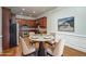 Cozy dining area featuring a round table, seating for four, and a modern stainless steel kitchen nearby at 2300 Peachford Rd # 3411, Dunwoody, GA 30338