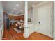 Entryway with wood floors that leads to the eat-in kitchen featuring stainless appliances and a decorative column at 2300 Peachford Rd # 3411, Dunwoody, GA 30338