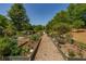A long view of the garden, framed by greenery and healthy plants at 2300 Peachford Rd # 3411, Dunwoody, GA 30338