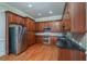 Bright kitchen features stainless steel appliances, granite countertops, and wood cabinets at 2300 Peachford Rd # 3411, Dunwoody, GA 30338