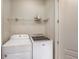 Laundry room with a white washer and dryer set at 2300 Peachford Rd # 3411, Dunwoody, GA 30338