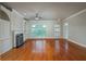 Bright and airy living room with hardwood floors, fireplace, and large windows at 2300 Peachford Rd # 3411, Dunwoody, GA 30338