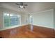 Bright living room featuring hardwood floors, large windows, and neutral paint colors at 2300 Peachford Rd # 3411, Dunwoody, GA 30338