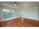 Bright living room features hardwood floors, ceiling fan and large windows at 2300 Peachford Rd # 3411, Dunwoody, GA 30338