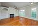 Comfortable living room with hardwood floors, built-in shelves, and plenty of natural light at 2300 Peachford Rd # 3411, Dunwoody, GA 30338