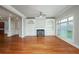 Open-concept living room with hardwood floors, fireplace, and ample space at 2300 Peachford Rd # 3411, Dunwoody, GA 30338