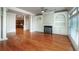 Spacious living room features hardwood floors, built-in shelving, fireplace, and access to the kitchen at 2300 Peachford Rd # 3411, Dunwoody, GA 30338