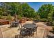 Outdoor patio area featuring multiple seating areas and a built-in grilling station at 2300 Peachford Rd # 3411, Dunwoody, GA 30338