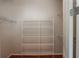 Spacious walk-in closet features adjustable white wire shelving and wood flooring at 2300 Peachford Rd # 3411, Dunwoody, GA 30338