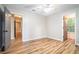 Bright bedroom with neutral walls, ceiling fan, hardwood floors, and two closets at 328 Bentley Pl # 328, Tucker, GA 30084
