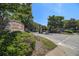Bentley Place entrance with stone signage, manicured landscaping, and secure gate at 328 Bentley Pl # 328, Tucker, GA 30084