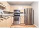 A kitchen featuring wooden cabinets, granite countertops, and stainless steel appliances at 328 Bentley Pl # 328, Tucker, GA 30084