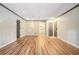 Open-concept living room showcases hardwood floors and a smooth transition into the kitchen area at 328 Bentley Pl # 328, Tucker, GA 30084