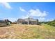Spacious backyard featuring a screened porch, playground equipment, and a large lawn area at 569 Lovell Rd, Temple, GA 30179