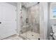 Modern bathroom features a glass enclosed shower with gray tile and a built-in bench at 569 Lovell Rd, Temple, GA 30179