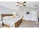 Bedroom with a ceiling fan, vaulted ceiling, carpet floors, and large bed at 569 Lovell Rd, Temple, GA 30179