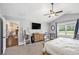 Spacious bedroom with a ceiling fan, vaulted ceiling, carpet floors, and natural light at 569 Lovell Rd, Temple, GA 30179