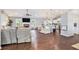 Spacious living room featuring hardwood floors, a cozy fireplace, and ample natural light for comfortable living at 569 Lovell Rd, Temple, GA 30179