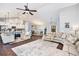 Open-concept living room flowing into the kitchen and dining area, perfect for entertaining and Gathering gatherings at 569 Lovell Rd, Temple, GA 30179