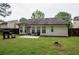 Spacious backyard with a well-maintained lawn, fence, and room for outdoor activities at 7113 Silver Mine Xing, Austell, GA 30168