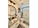 Updated bathroom with granite countertop, sleek black fixtures, and a modern tiled shower at 7113 Silver Mine Xing, Austell, GA 30168
