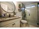 Modern bathroom boasts a sleek glass shower, granite countertops, and updated fixtures at 7113 Silver Mine Xing, Austell, GA 30168