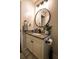 Renovated bathroom with a granite countertop vanity, updated lighting, and modern fixtures at 7113 Silver Mine Xing, Austell, GA 30168
