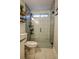 Bathroom featuring a modern glass shower with sleek tile and black fixtures at 7113 Silver Mine Xing, Austell, GA 30168
