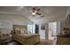 This spacious bedroom offers natural light, wood floors, ceiling fan, and access to the bathroom and walk-in closet at 7113 Silver Mine Xing, Austell, GA 30168