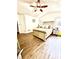 Bright bedroom featuring hardwood floors, a decorative bed frame, and natural light at 7113 Silver Mine Xing, Austell, GA 30168