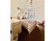 Cozy bedroom with natural light, floral bedding, and decorative wall art at 7113 Silver Mine Xing, Austell, GA 30168