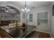 Cozy Dining room featuring a dark wood table that is well lit with natural light at 7113 Silver Mine Xing, Austell, GA 30168