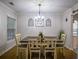 Bright dining room with modern chandelier and space for entertaining at 7113 Silver Mine Xing, Austell, GA 30168