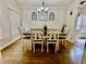 Formal dining room with a wooden table, matching chairs, and decorative wall art at 7113 Silver Mine Xing, Austell, GA 30168