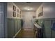 Inviting home foyer with stylish wainscoting, hardwood floors, and decorative furnishings at 7113 Silver Mine Xing, Austell, GA 30168