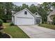 Well-maintained home featuring an attached two car garage and an expansive driveway at 7113 Silver Mine Xing, Austell, GA 30168