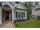 A welcoming entrance with brick accents, decorative porch decor, and a well-kept lawn at 7113 Silver Mine Xing, Austell, GA 30168