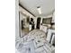 Spacious kitchen with white cabinets, stainless steel appliances, and stylish herringbone floors at 7113 Silver Mine Xing, Austell, GA 30168