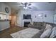 Comfortable living room featuring a cozy fireplace and plush sectional sofa at 7113 Silver Mine Xing, Austell, GA 30168