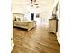 Spacious main bedroom featuring a ceiling fan, wood floors, and a white accent dresser at 7113 Silver Mine Xing, Austell, GA 30168